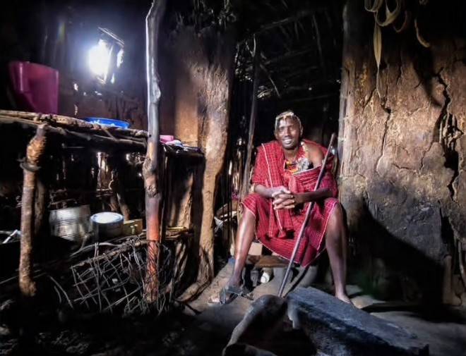 A Maasai elder at home in a traditional hut