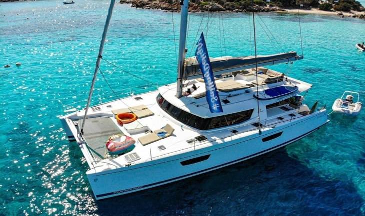 The Afrikando yacht in turquoise water